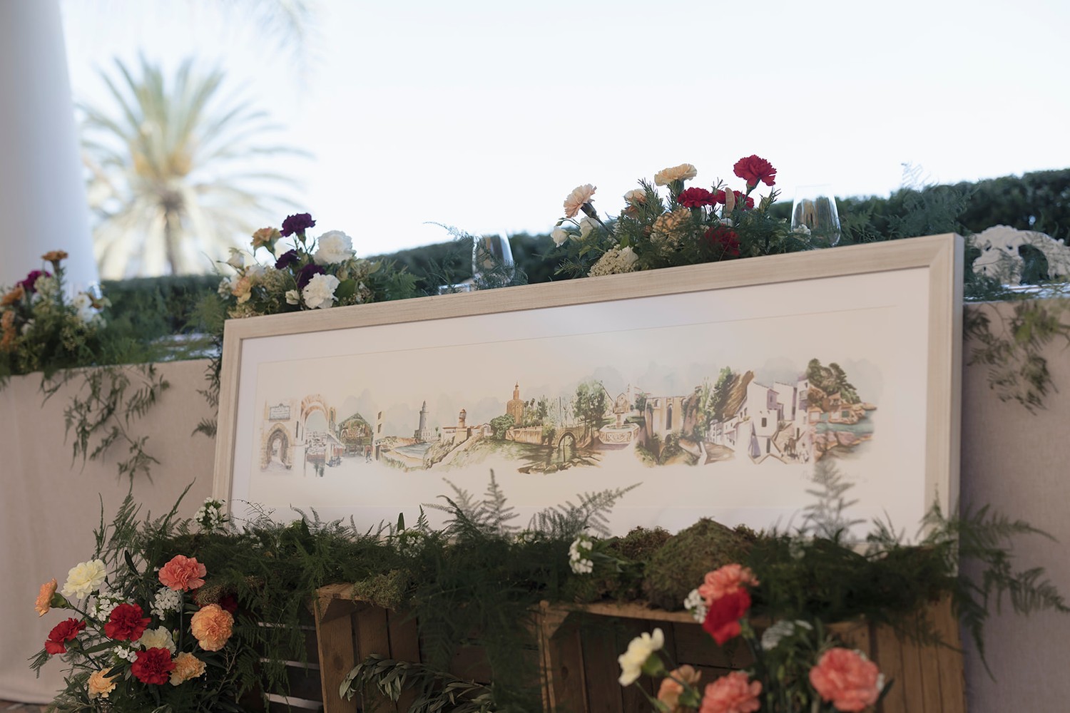 Acuarela panorámica de gran formato con los lugares de la pareja, presidiendo el banquete de una boda